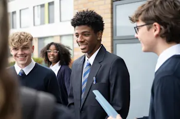 Teenagers chatting outside school